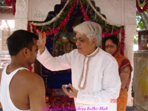 Tilak on forehead done for Govind in between  the pujan